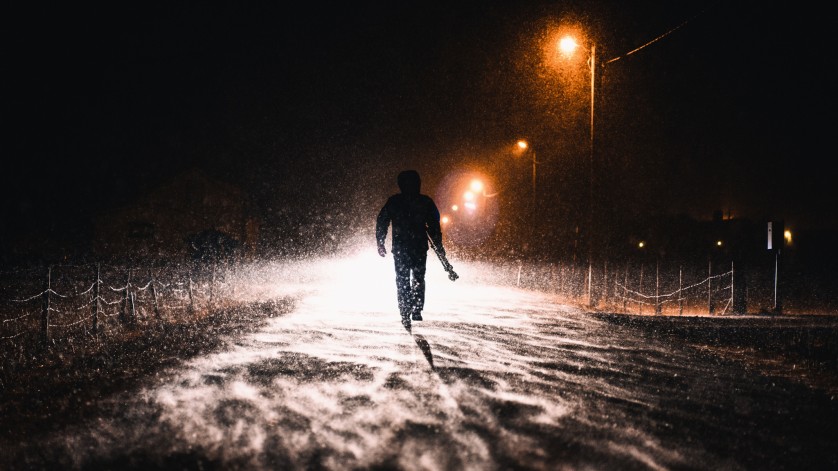 On our first night in camp, the blizzard hit fast and furious. Always looking for a dramatic photograph, Chris walks in search of another night shot in the blistering snow.