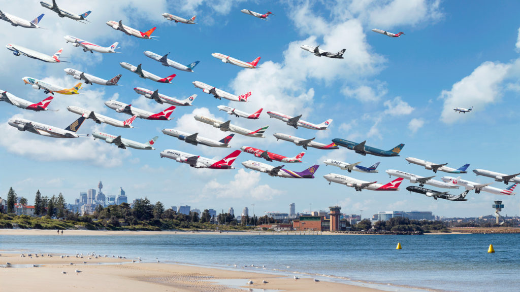 Sydney Kingsford Smith 34L Planes depart over Botany Bay and Sydney's Central Business District from Runway 34L at Syndey airport.